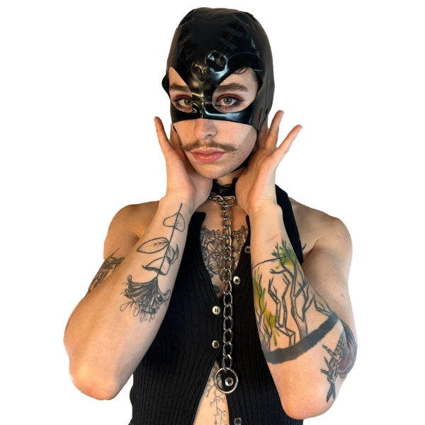 A model wearing black open mouth and eye basic latex hood, front view.