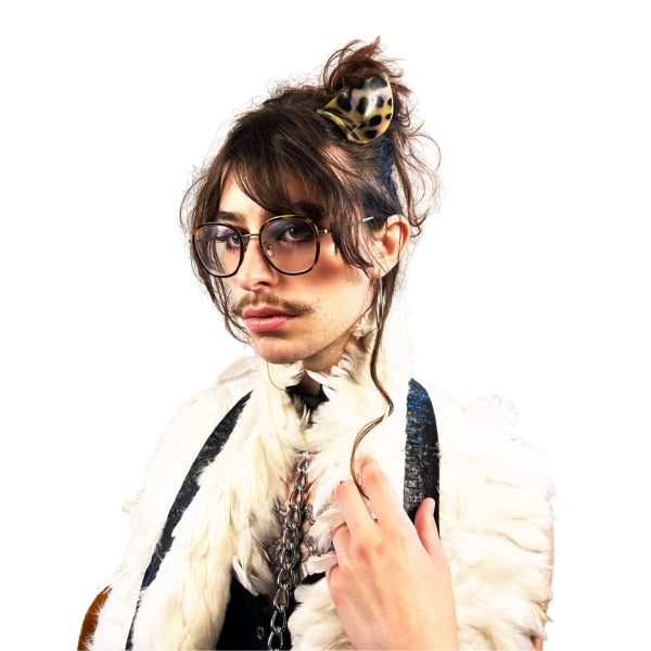 Close up of a model wearing the white latex feather boa draped around their shoulders.