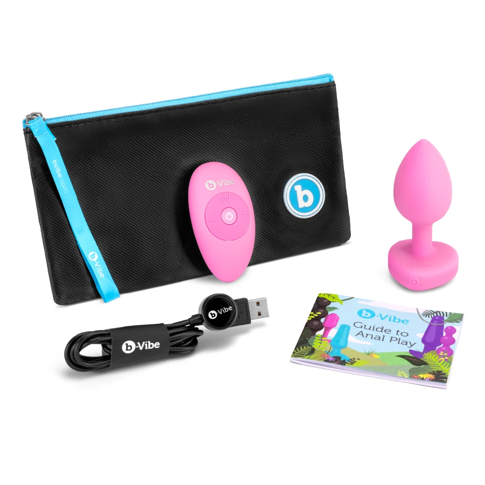 The pink The pink Vibrating Heart Jewel Plug with Remote, storage bag, charging plug and instruction manual.
