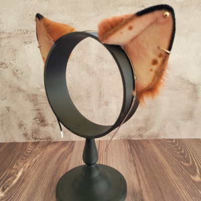 Left ear of Deluxe Vegan Animal Ear Headband on the stand