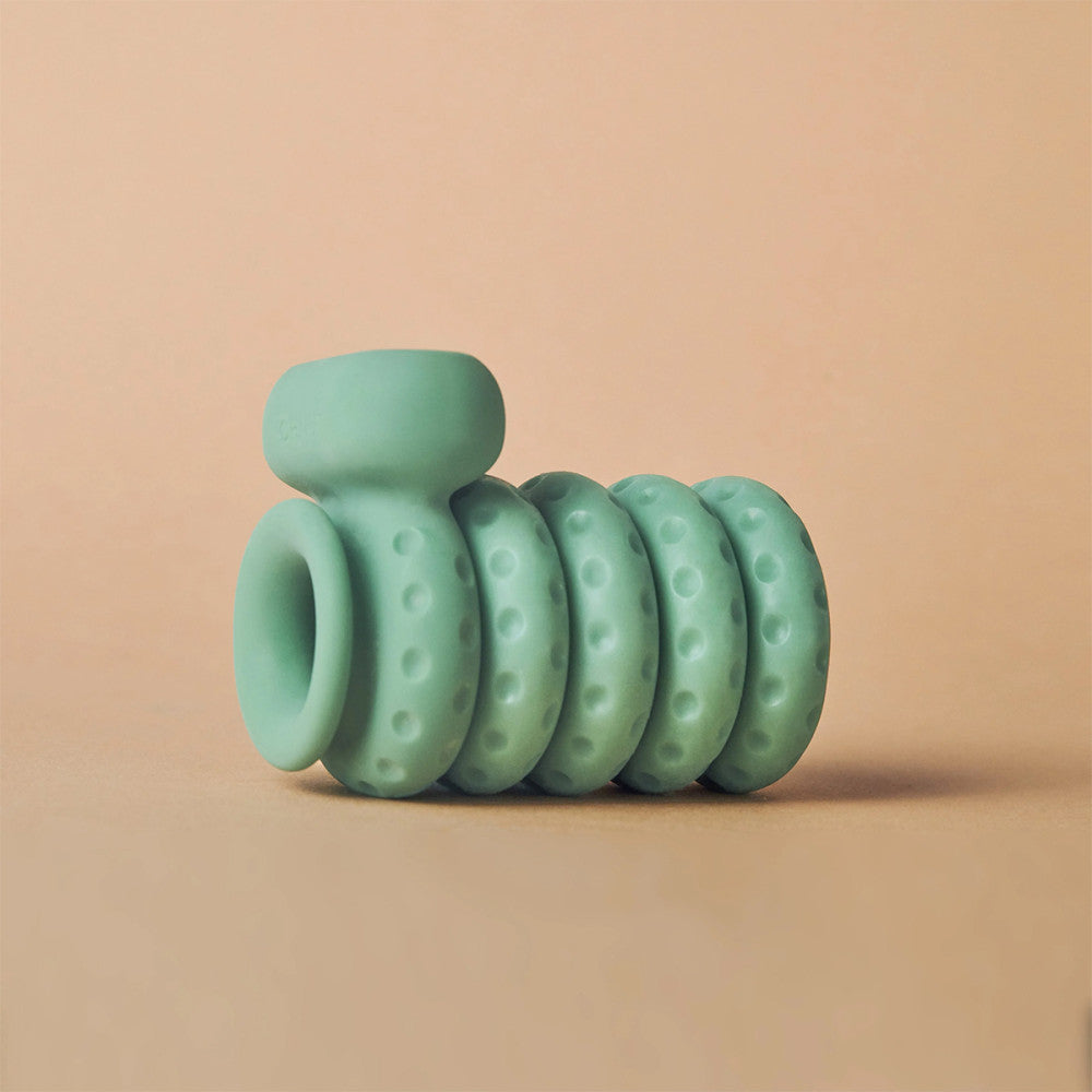 The OhNut Vibrating cock ring with buffers attached.