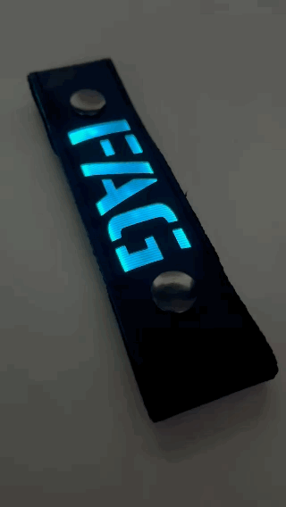 A Gif of the "FAG" Glow Center Strap flashing in different colors.