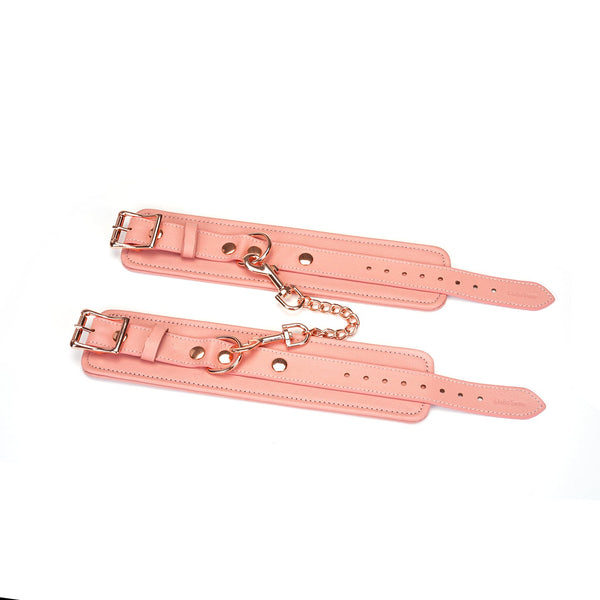 Pink Leather Wrist Cuffs With Rose Gold Hardware Unbuckled Overhead View