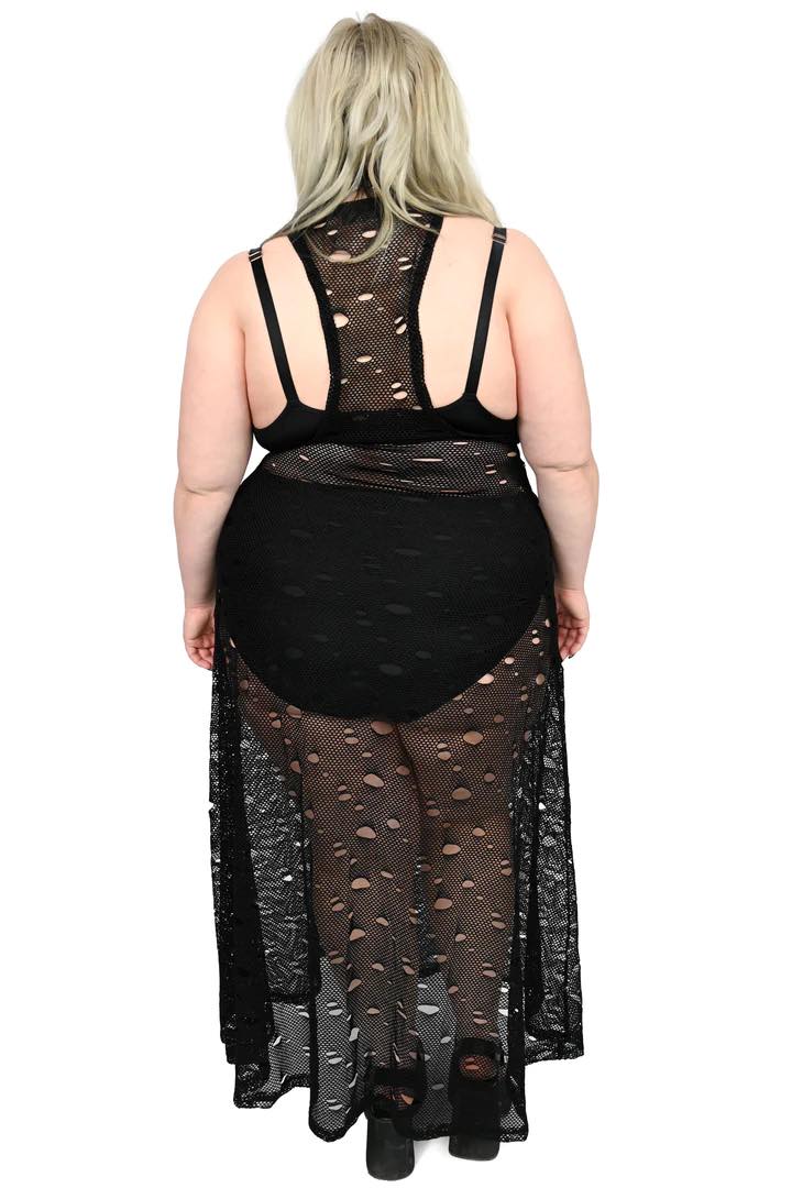 A plus size model wearing the Jax Fishnet Maxi Dress, rear view.