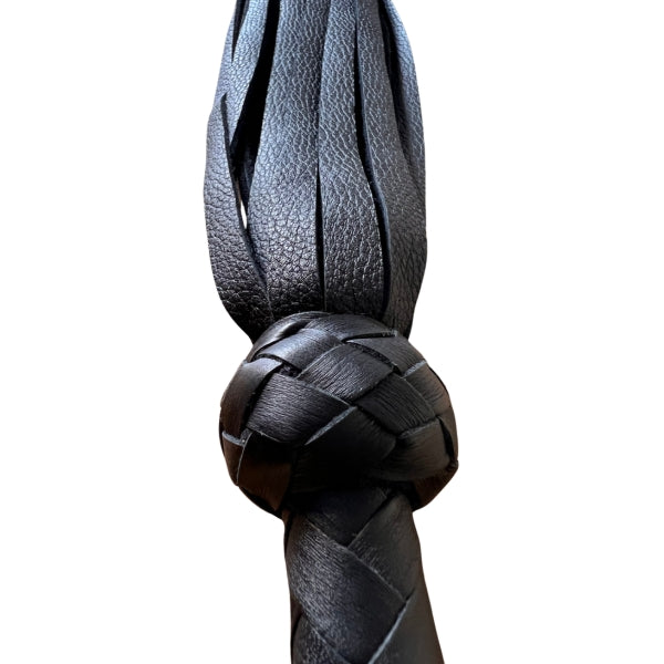Falls coming out of handle of black leather Moose Flogger
