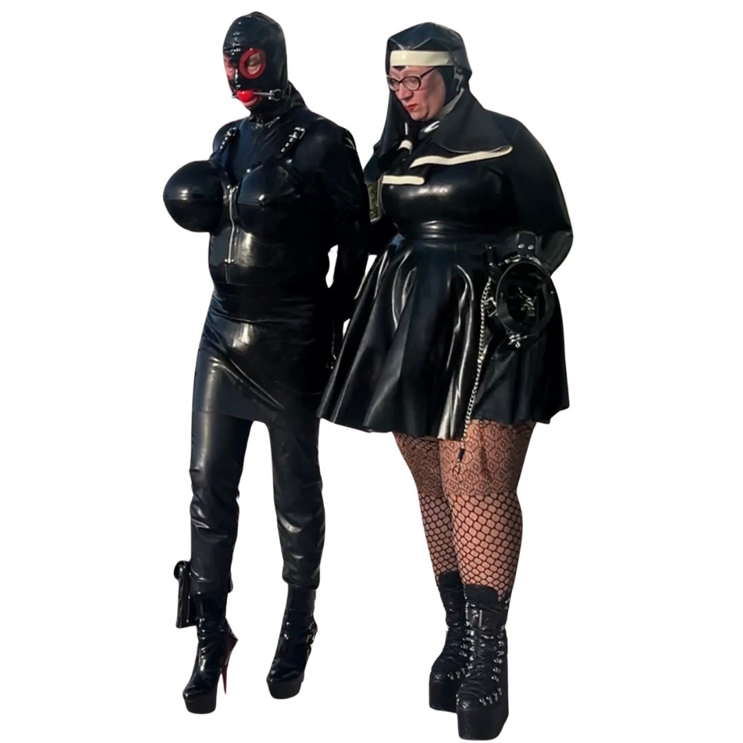 Model wearing Latex High-Neck Hepburn Dress with Filthy Habbit Headpiece holding arm of Drone