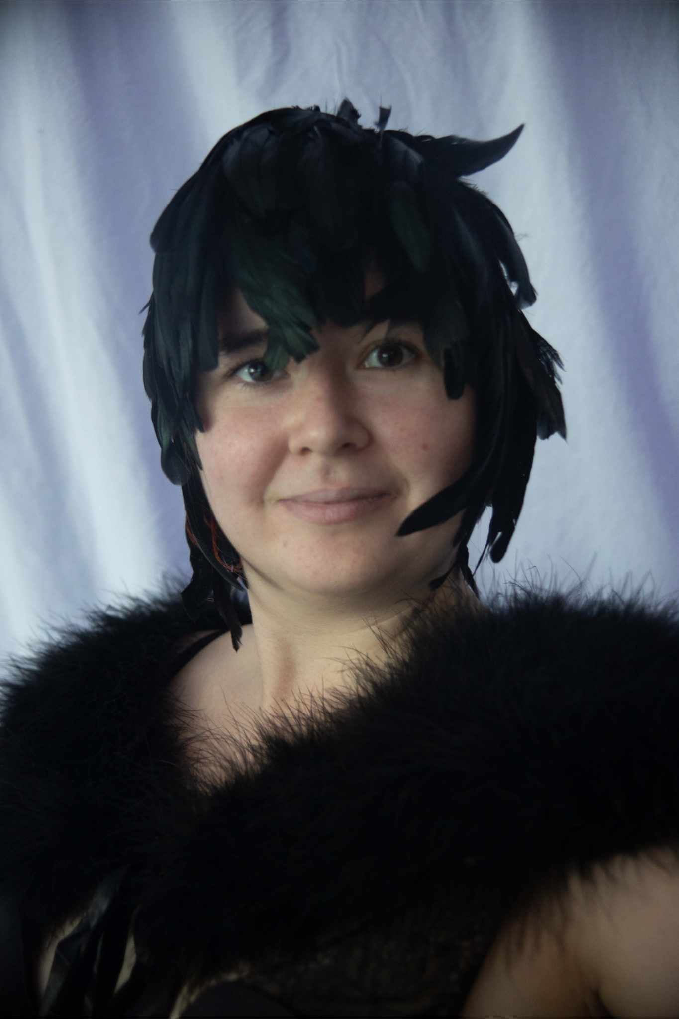 model wearing Schlappen Feather Wig