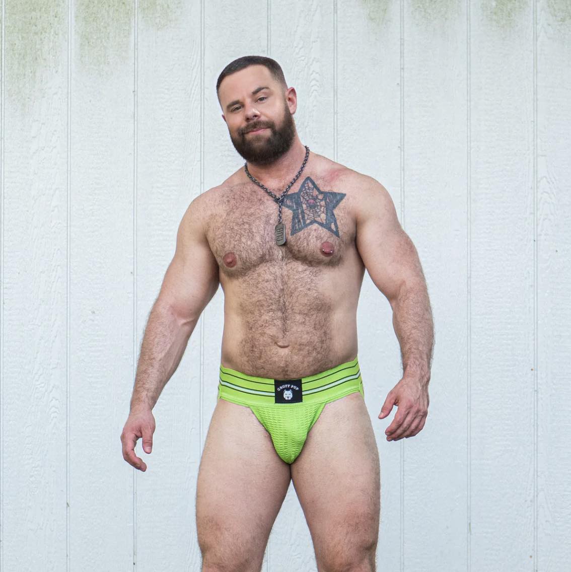 A model wearing the Nitro Green Gruff Pup UV Quarterback Jock, front view.