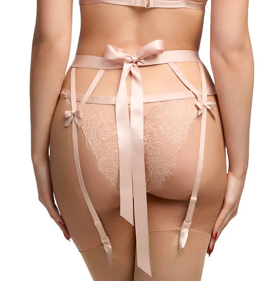 A model wearing the Fantacist Antique Peach Bow Suspenders with the Fantacist Antique Peach Tie Side Glimmer Lace Open Knickers, rear view.