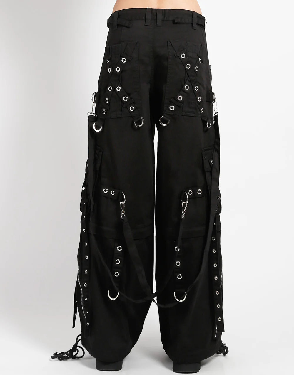 The back of X strap zip off pants in black.