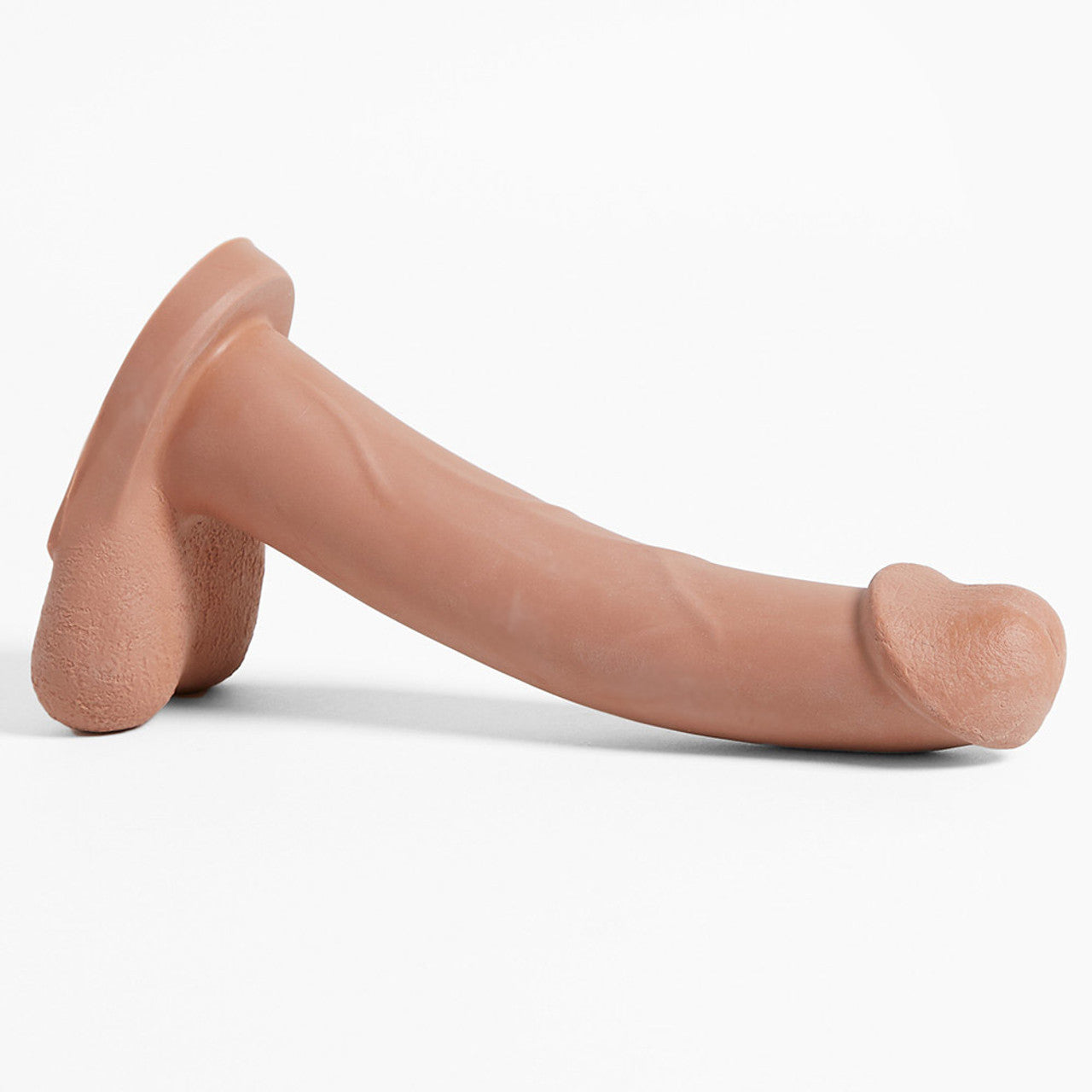 The light Admiral Dual Density Dildo laying with balls down.