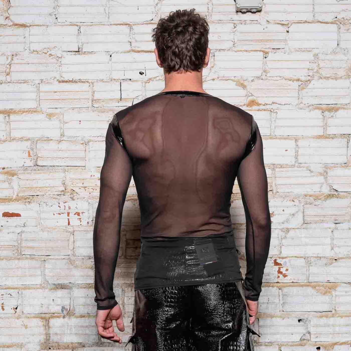 The Ali Mesh Fishnet & Patent V Neck Long Sleeve T-Shirt on model wearing black patent leather pants, rear view.