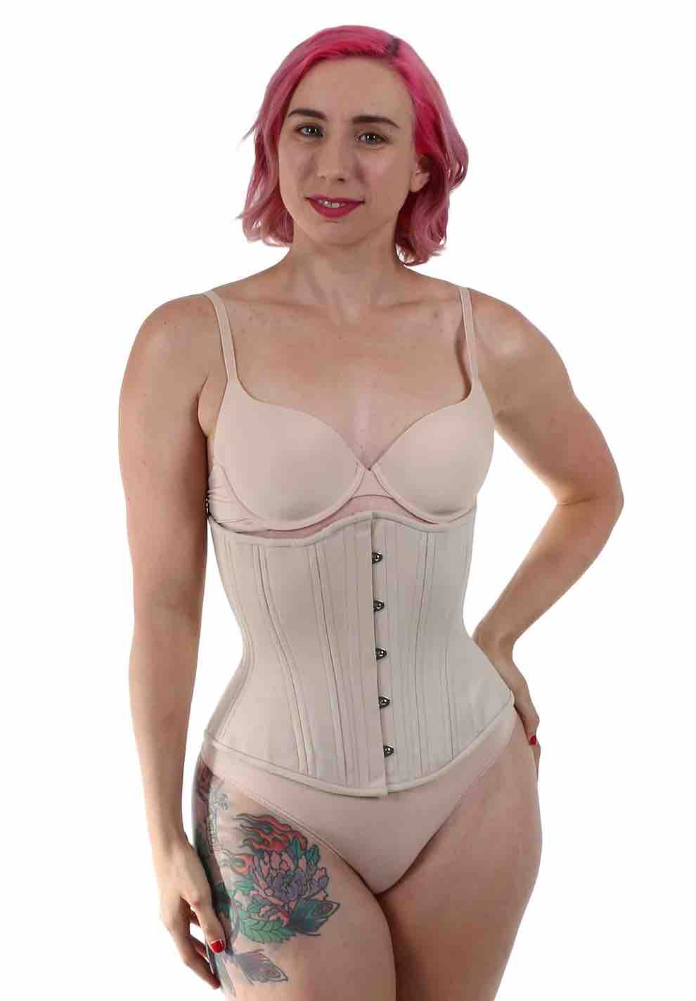 A model wearing the cream Cotton Shapewear Mid Length Underbust Corset- Hourglass over a cream bra and panties, front view.