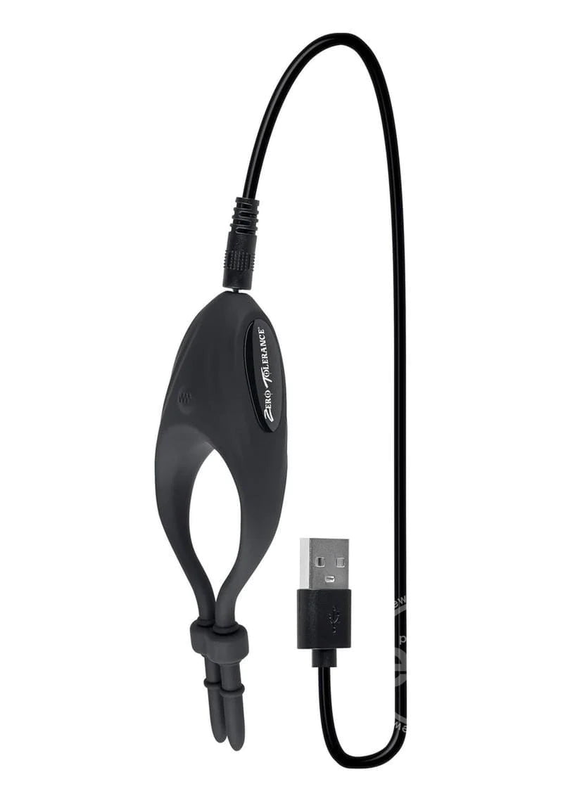 The Perfect Fit Vibrating Cock Ring with its charging cord plugged in.