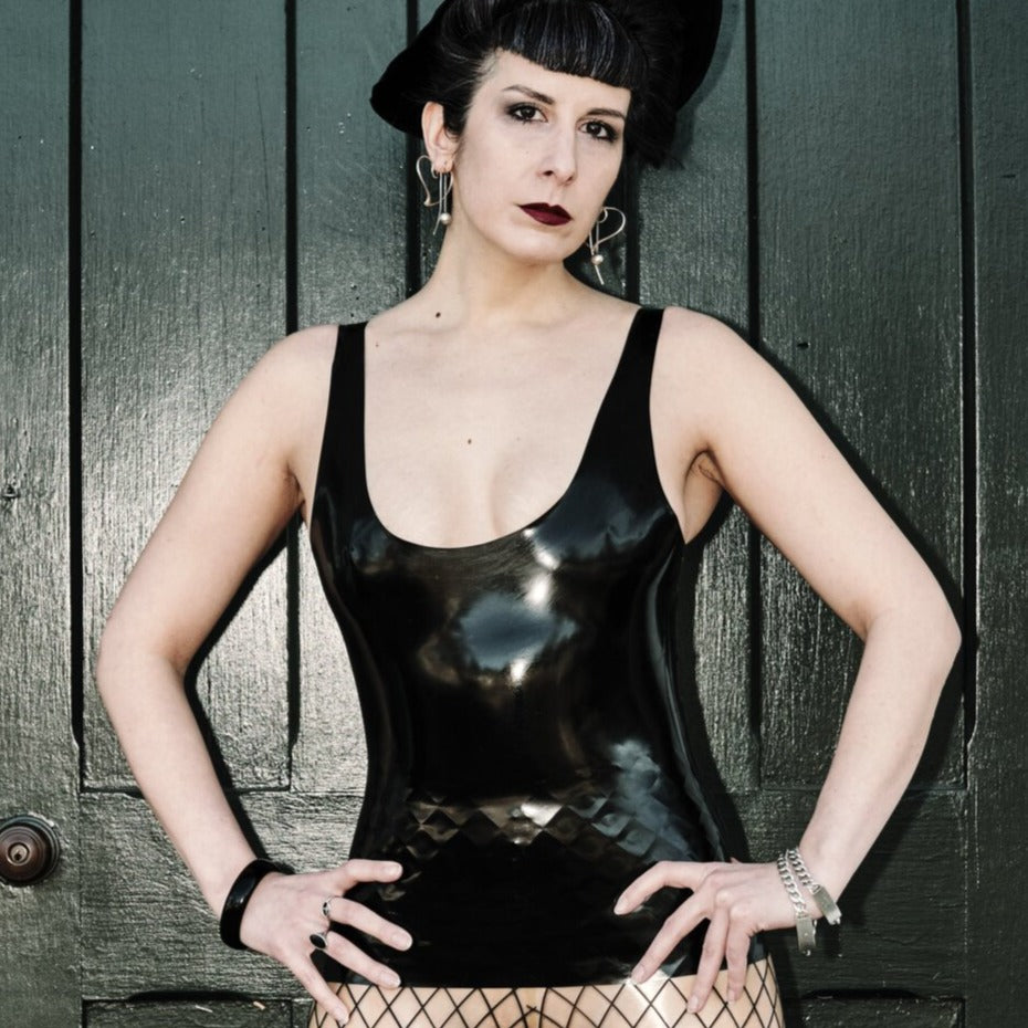 A model showing the front of the black Latex Tank Top.