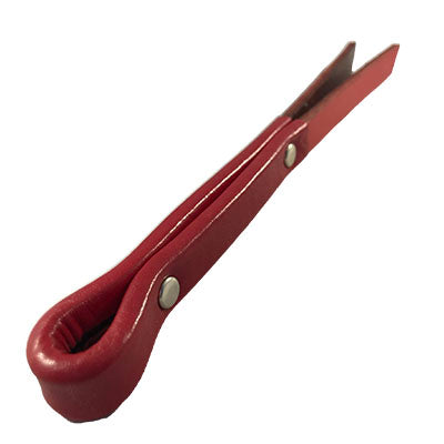 A plain red 1/2 inch leather slapper on its side.