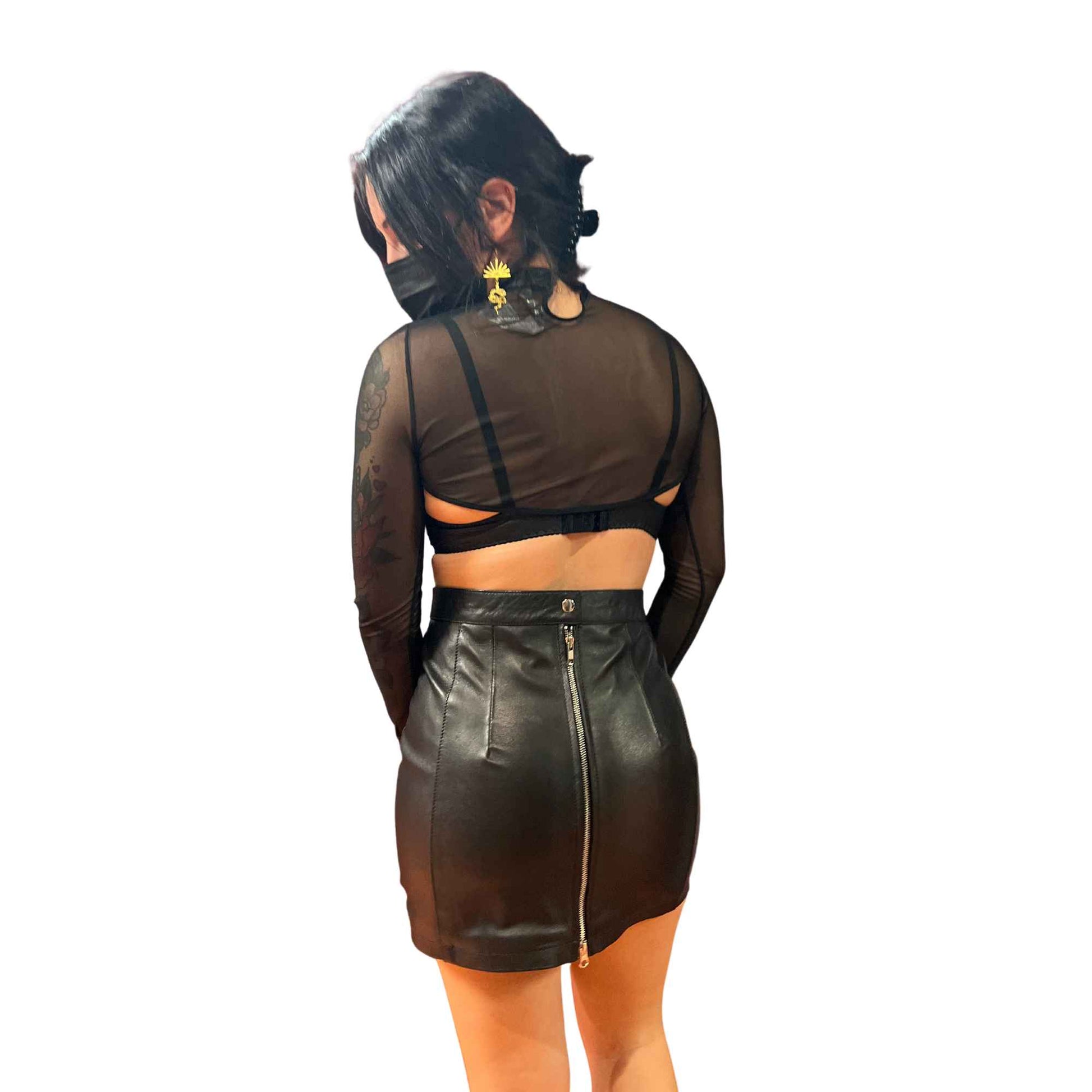 Model wearing Mesh Shrug highlighting mesh back