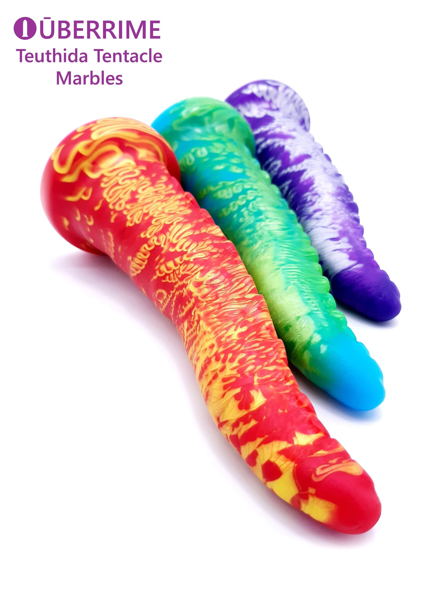Teuthida Tentacle Dildo in three different marble shades lying vertically 
