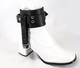 side right view of white patent boot with black shoe lock ankle cuffs, showing buckle strap