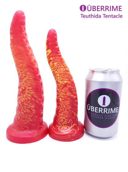 Teuthida Tentacle Dildo in two different sizes standing vertically next to soda can for size comparison