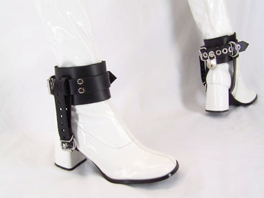 right side and back heel view of white patent boots with black shoe lock ankle cuffs displayed