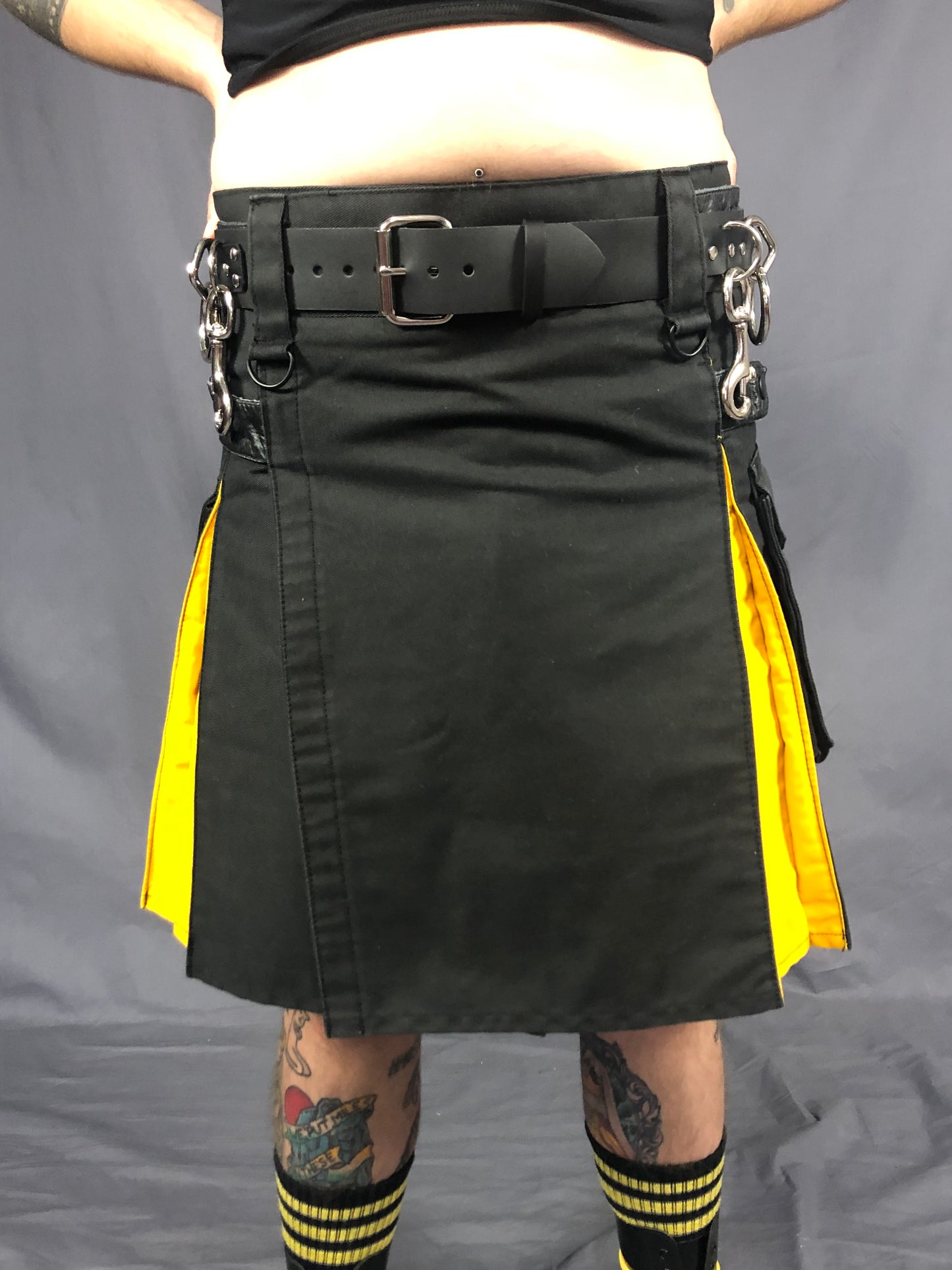 front close up of strapped bondage belt worn with kilt