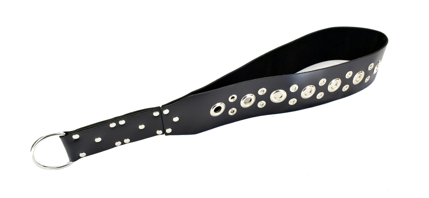 Black big leather slapper strap laid on its side with tentacle detailing side out showing slapper loop, against white background.