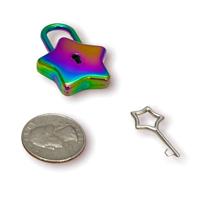 The rainbow Star Lock and key next to a quarter for size comparison.