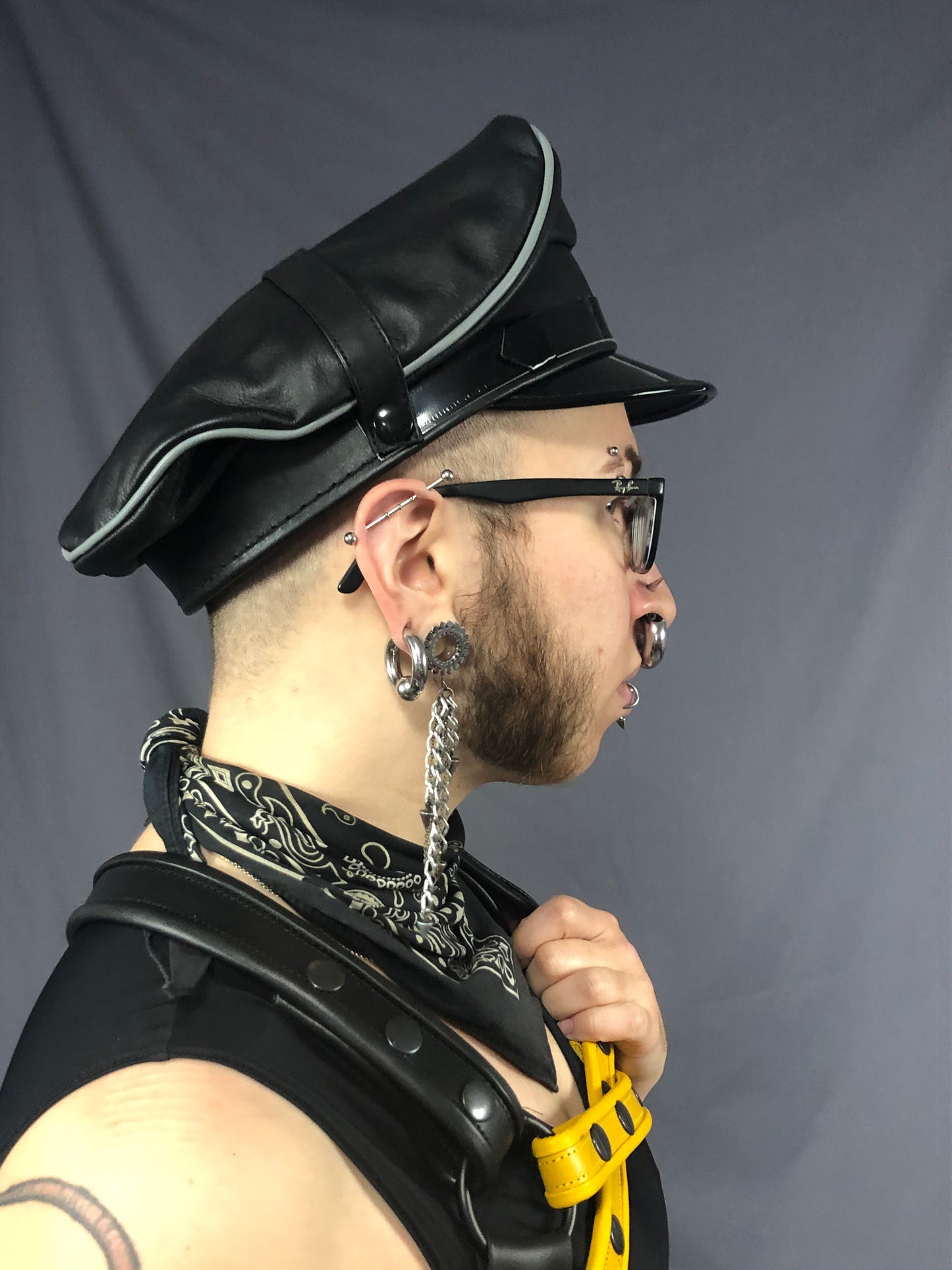 Right side view of black/grey prowler leather military cap.