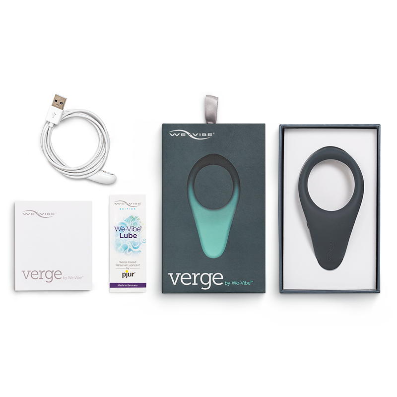 The The slate gray We-Vibe Verge Cock Ring and Perineum Vibrator, its packaging and accessories.