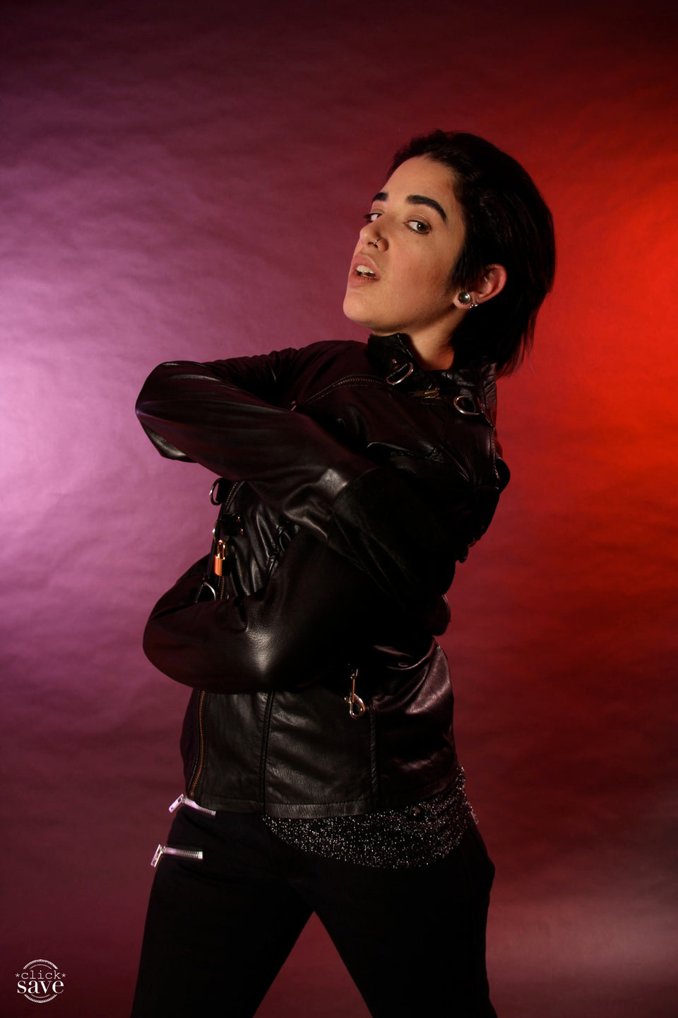 A model artfully displaying the front of the Cowhide Strait / Jacket.