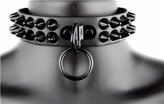 The Black and Black 2 Row Cone Stud Collar with Ring on a mannequin head.