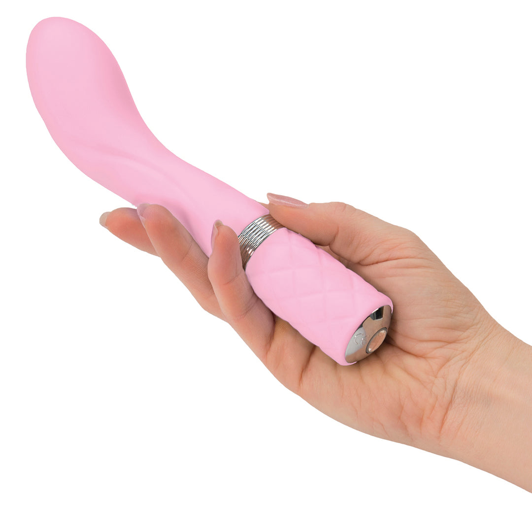 A hand holding the Pillow Talk Sassy G-Spot Vibrator Pink