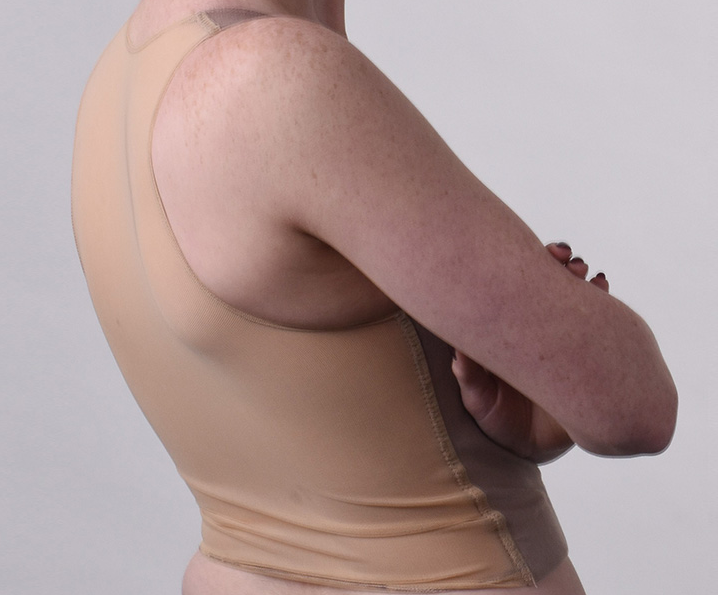 A model wearing the tan BURSLF Crop Binder, side view.