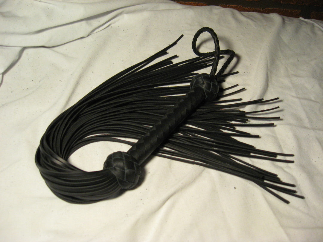 Black Revenge Flogger curled up.