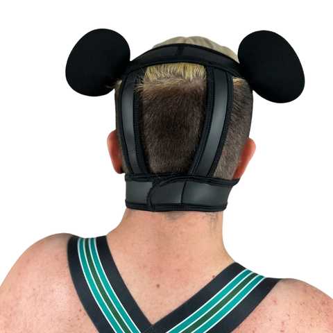 Back of green neoprene snap-on k-br muzzle with snap on green bear ears.