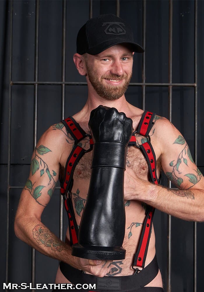 Hankey's Toys Gutpuncher with model holding in front of torso with fist knuckles facing camera