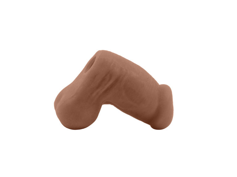 A profile shot of the hazelnut Jack Sleeve Stroker & Packer Dildo.