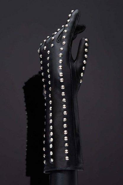 The outside of the Spiked Leather Forearm Glove on a mannequin hand.