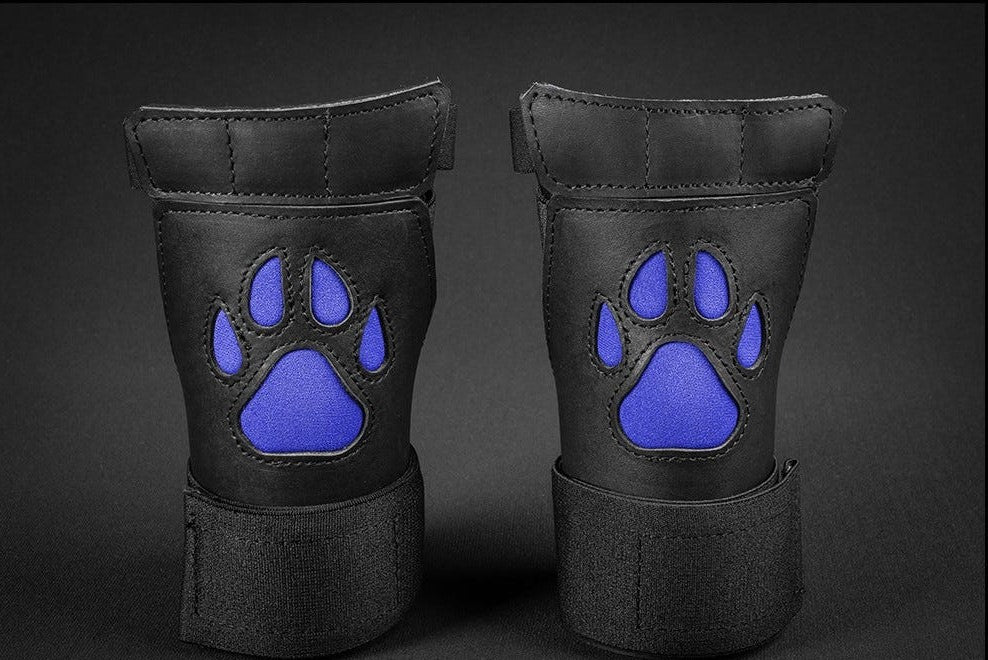 Close up of black/blue open paw puppy gloves.