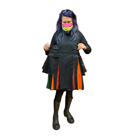 Model holding rainbow pride flag cargo kilt.