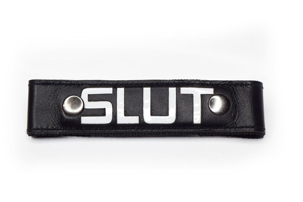 Glow Center Strap, "SLUT".