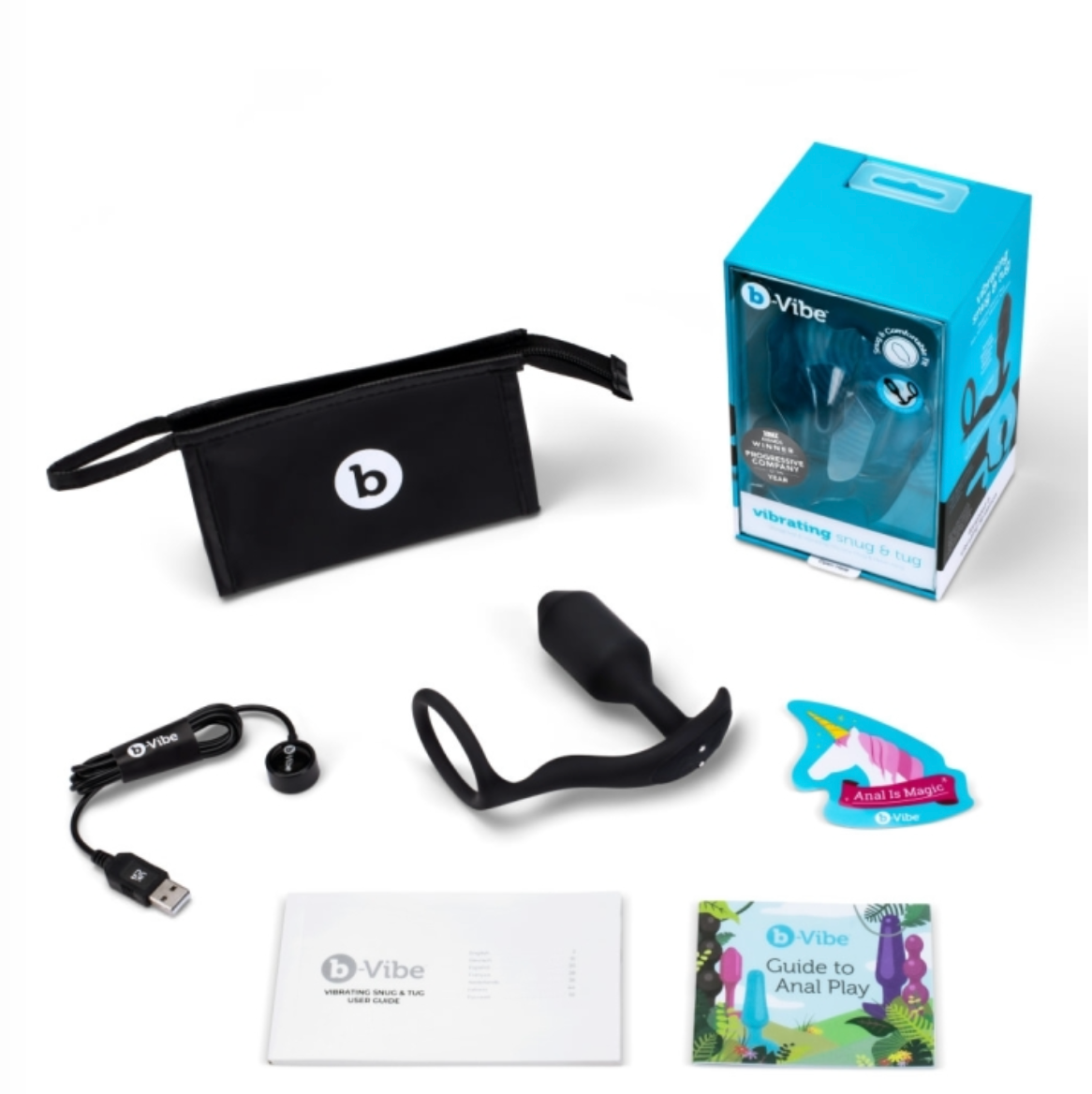 The blue box sits empty with its content spread out in front of it: a black b-vibe branded travel bag, a black charging cord, an "anal is magic" unicorn sticker, a colorful Guide to Anal Play booklet, and a more sedate User Guide for the Snug & Tug