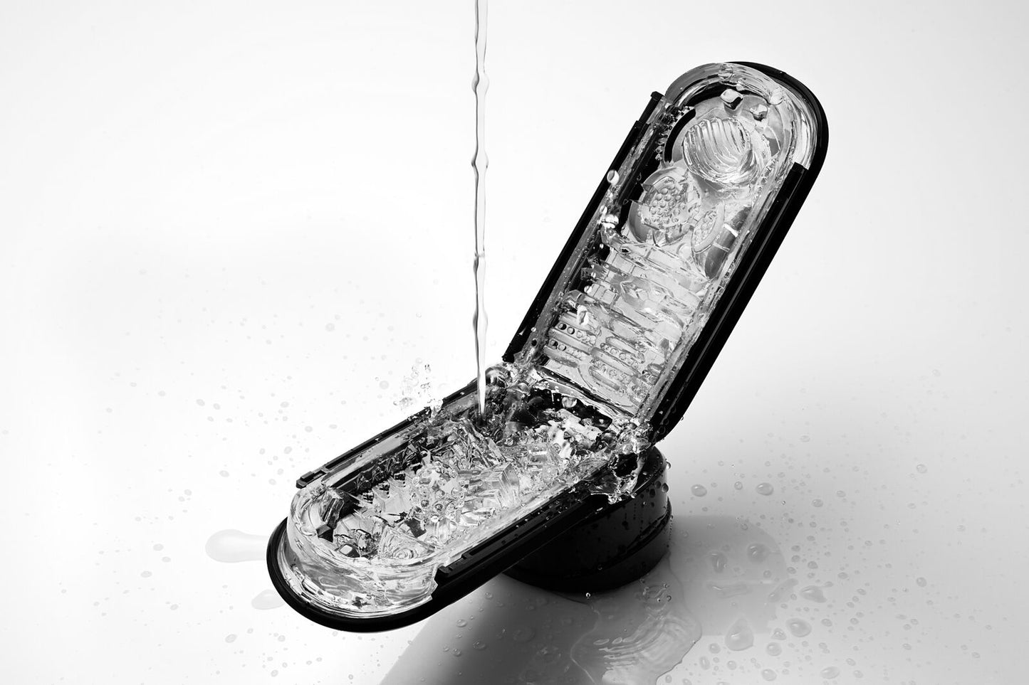 The black Tenga Flip 0 (Zero) Stroker in its open position.
