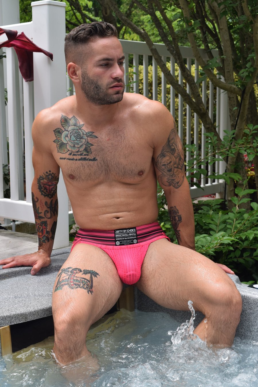 Model wearing the Neon Pink CumDump jock strap.