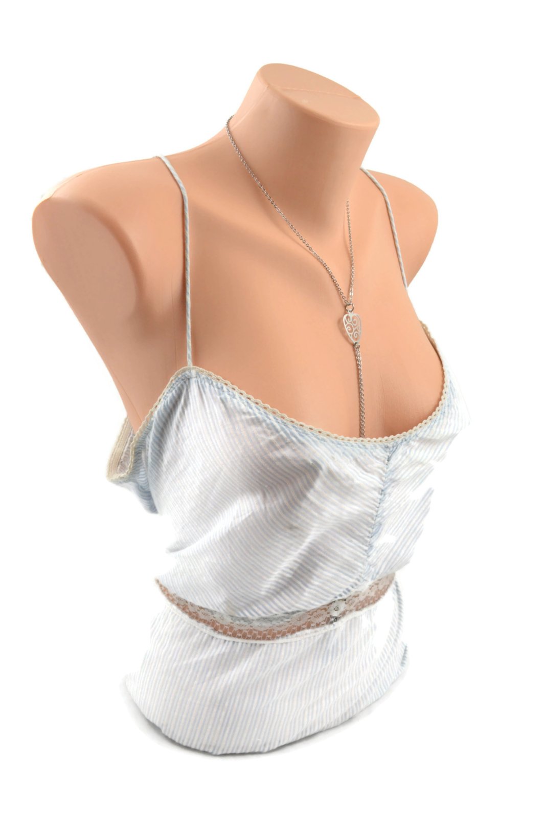 The Unchained Heart Collar with Nipple Chain on a mannequin wearing a silver camisole.