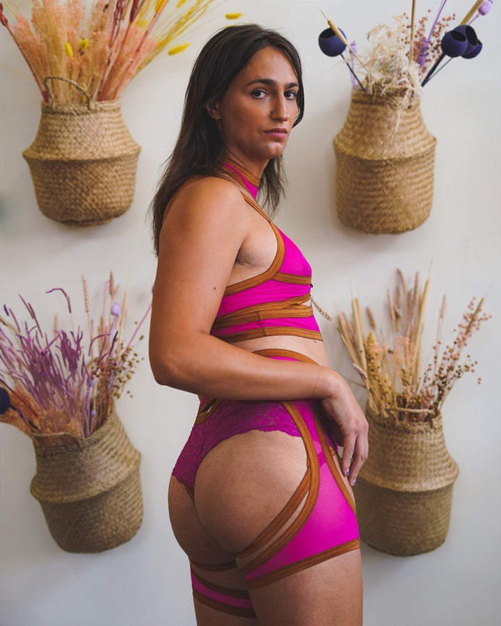 Model wearing the dragonfruit Mesh Leg Bands with the Mesh Body Harness, Mesh Vintage Soft Cup Bralette and matching shorts.
