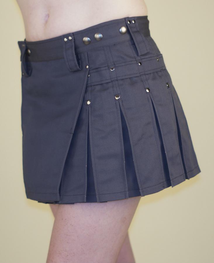 Gray mini kilt with silver rivets and pleats.