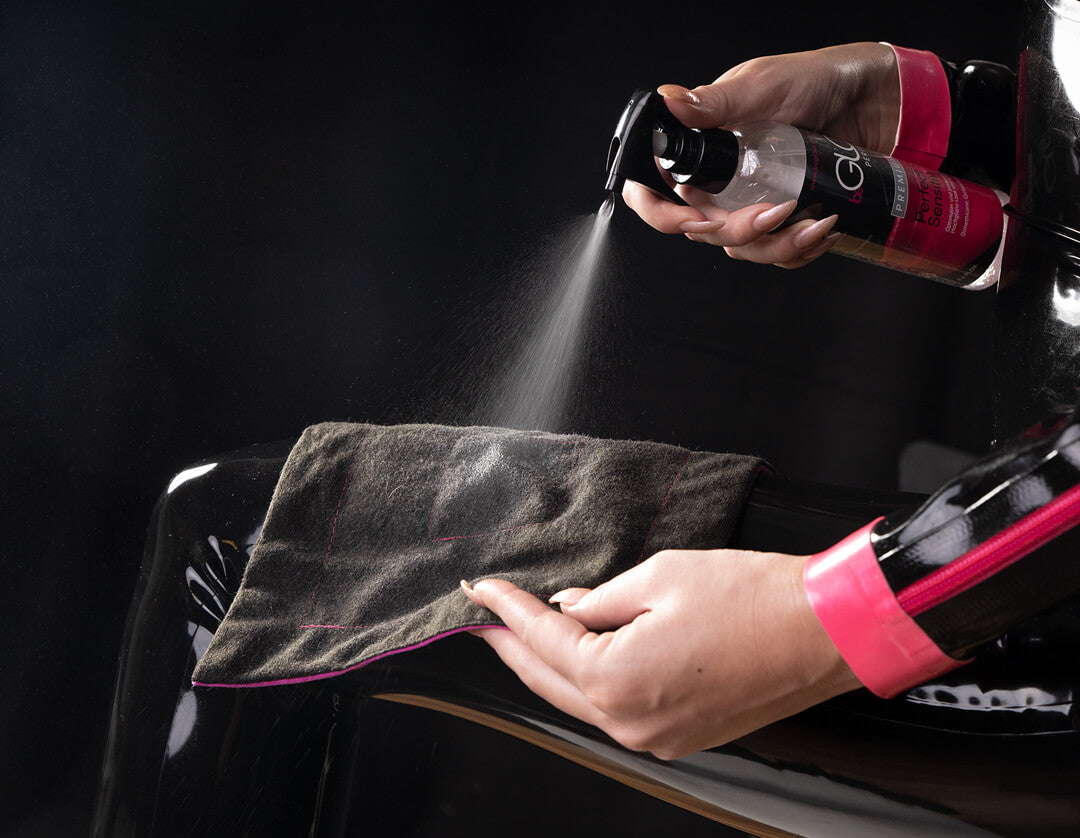 A model spraying the 250ml beGLOSS Perfect Shine onto a cloth.