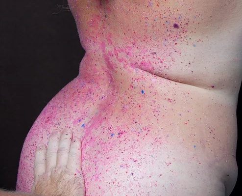 Purple wax melted on a model's back.